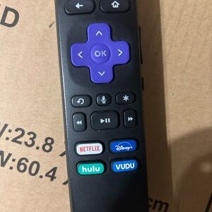 Roku Black Streaming Remote with Purple D-Pad and App Shortcuts